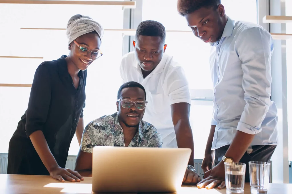 Freelancing Lessons: 10 Proven Tips For Lasting Success 4 Team Of Professionals Discussing Freelancing Lessons And Client Work