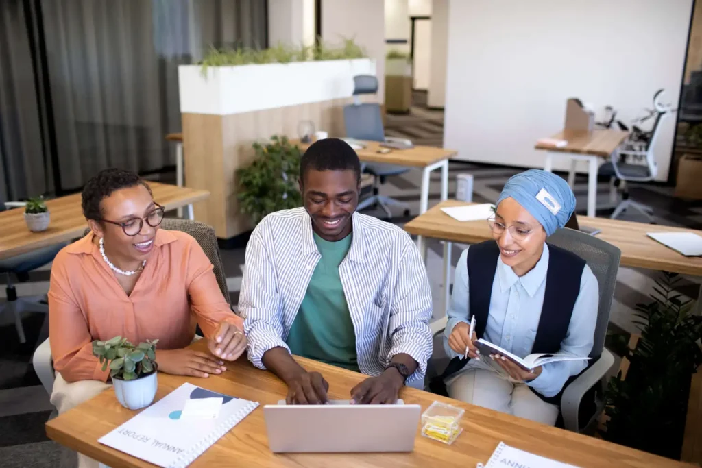Colleagues Working Together In An Office As One Way To Advance A Design Career